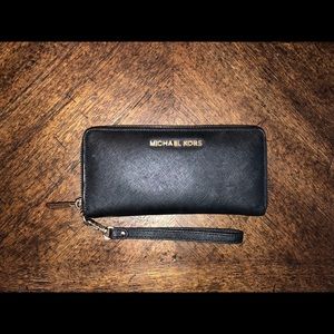 Michael Kors black wallet with wrist strap